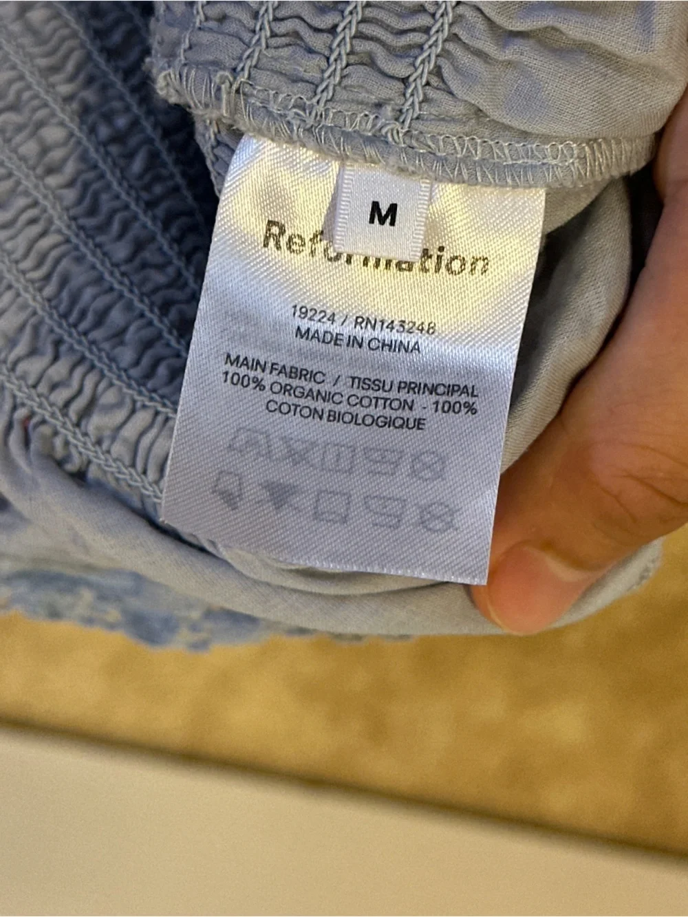 Reformation Roland Smocked Top in Mineral Blue